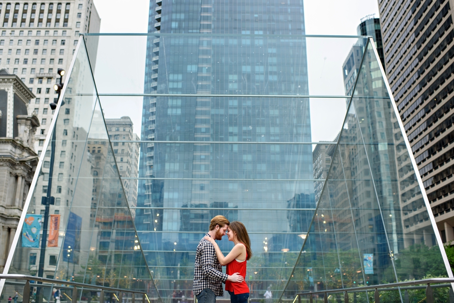 A couple take a moment to hug during their engagement session in Dilworth park in philadelphia.